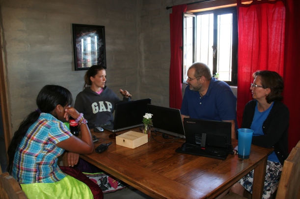 Our coworker Rachel checking translation with our consultants and a language helper